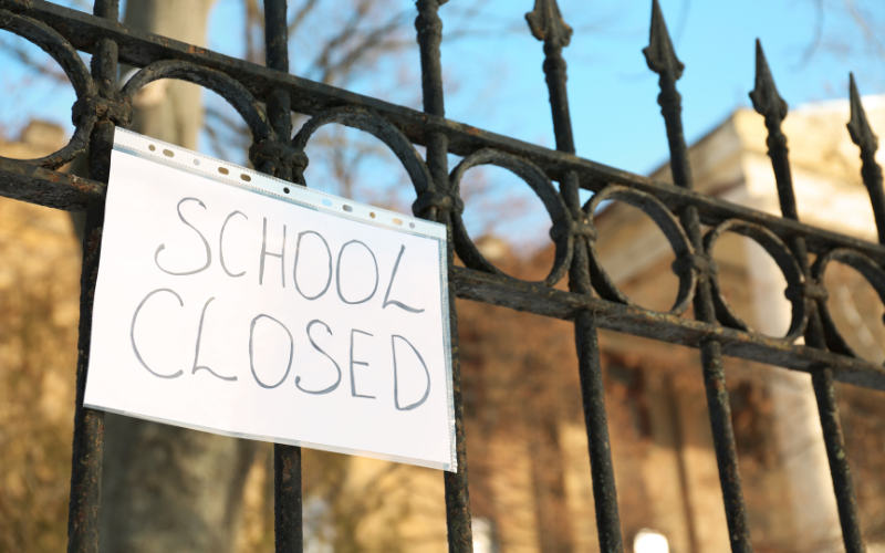 school closed sign on college university gates