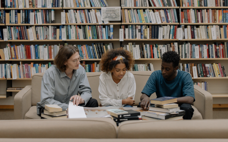 students reading in library